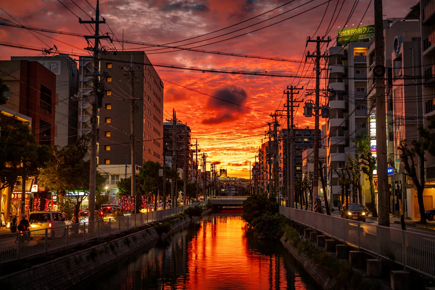On 8th August 2025, the weather in Okinawa at Miebashi River featured a striking sunset with a very red sky.