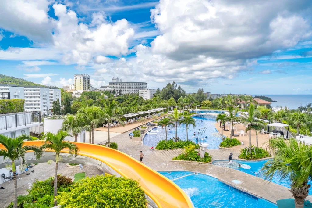 The weather in Okinawa on 15th August 2025. This is the view of the swimming pool inside the Oriental Hotel Resort. There were many children enjoying the slides.